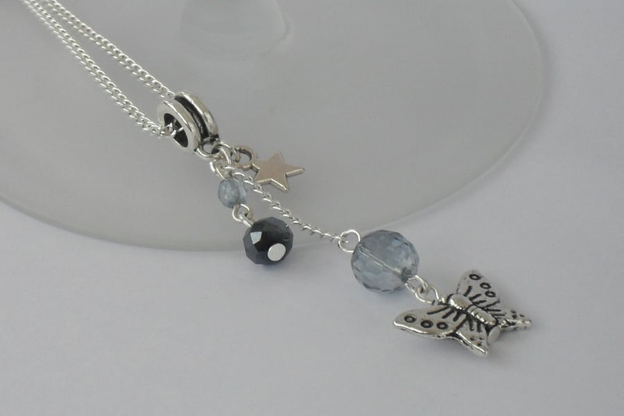 Blue crystal and butterfly charm necklace 