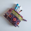 Toiletries or make up bag made from a Folk Art style print.