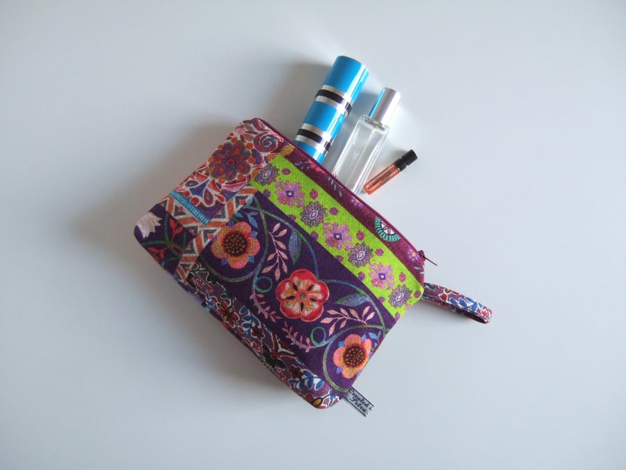 Toiletries or make up bag made from a Folk Art style print.