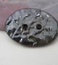 Large Obsidian Sprig Oval Handmade Ceramic Button - Image 1