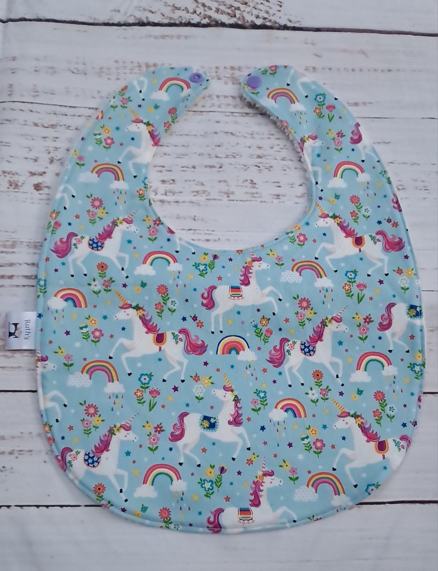 Toddler sized bamboo bib with unicorns and rainbows