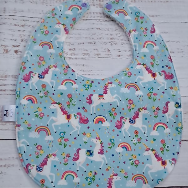 Toddler sized bamboo bib with unicorns and rainbows