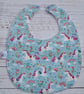 Toddler sized bamboo bib with unicorns and rainbows