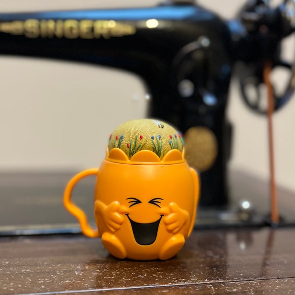 Pin cushion in a novelty plastic cup - embroidered flowers and bee