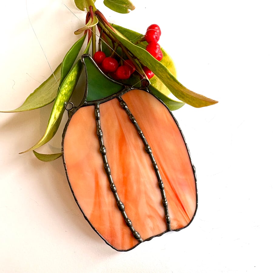 Wispy orange stained glass pumpkin window hanging, Halloween spooky suncatcher