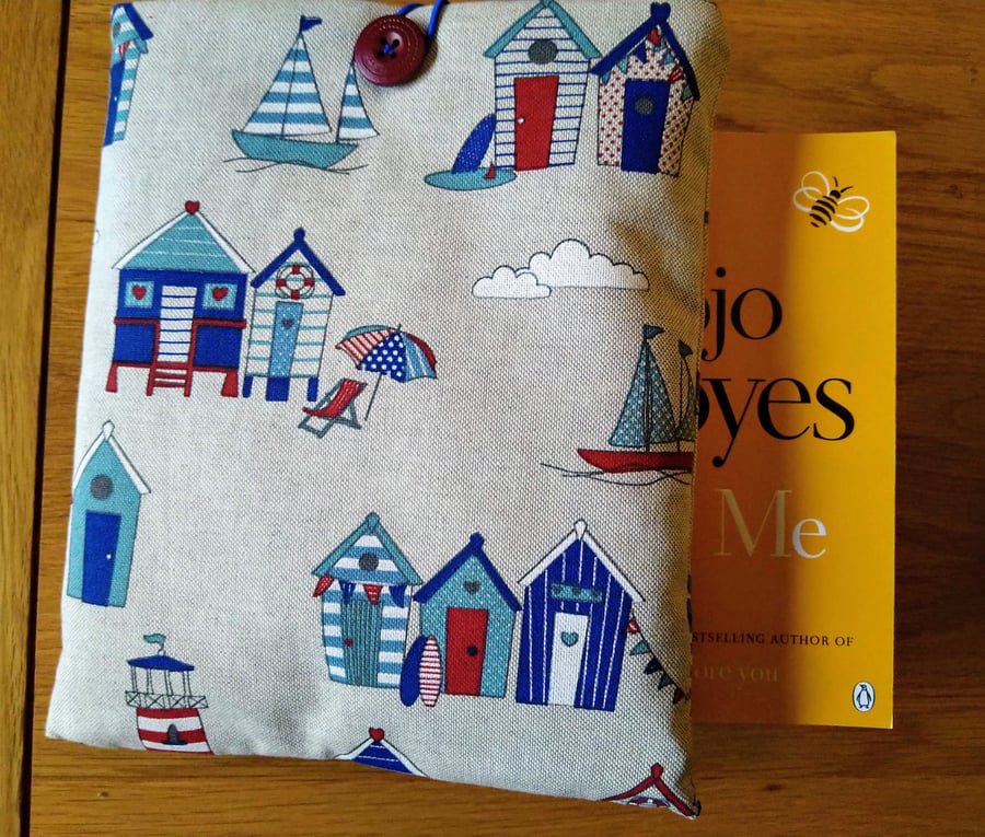 Book sleeve with beach huts and boats