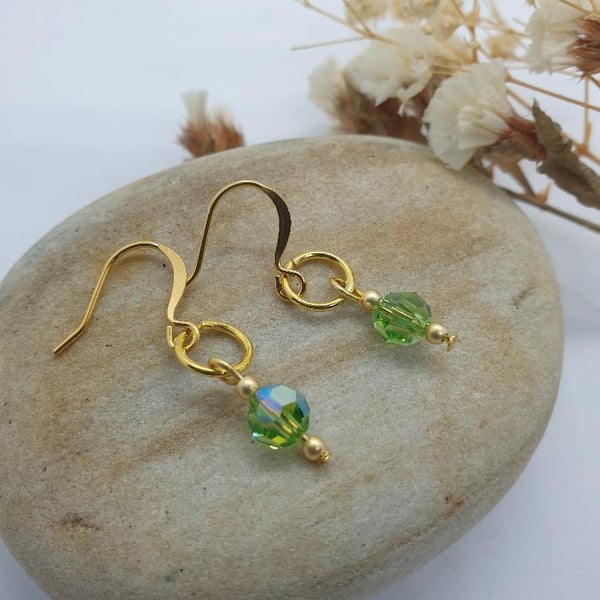 18 karat gold plated earrings with peridot green swarovski crystal beads 3.5cms 