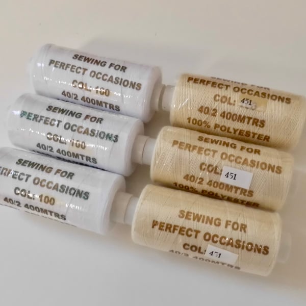 3 cream and 3 white reels of polyester sewing thread