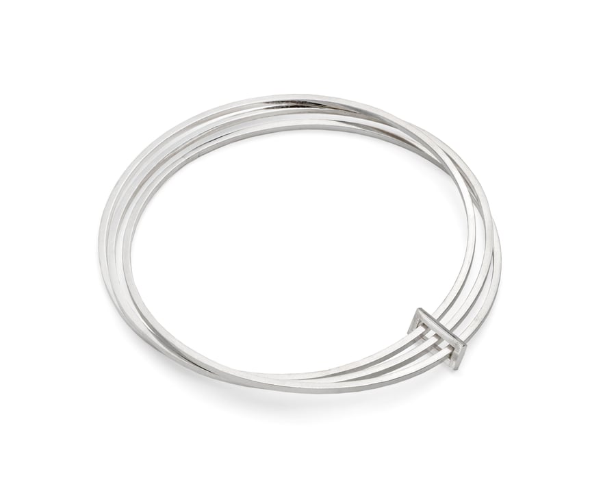 Isidora by Fedha - stylish set of three polished silver bangles with silver link