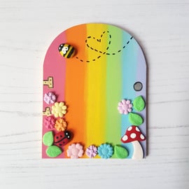 Rainbow garden themed fairy or elf door, nature, insects, flowers