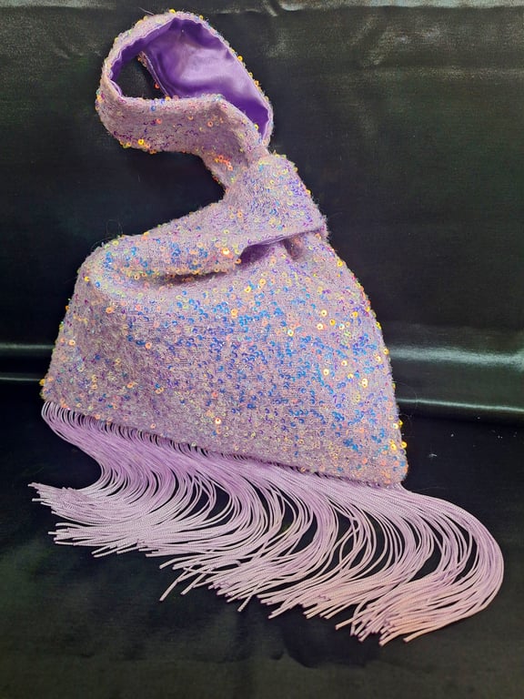 Lilac sequin Japanese Knot bag with 14cm tassel trim and satin lining.