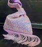 Lilac sequin Japanese Knot bag with 14cm tassel trim and satin lining.