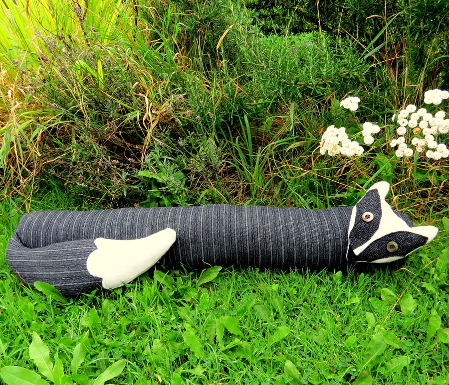 The curious badger.  A pinstripe badger draught excluder.