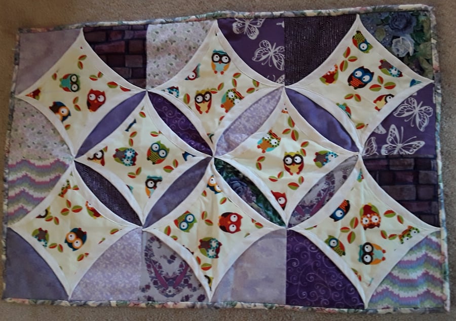 Homemade purple owl cathedral window table runner
