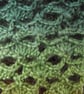 Crochet infinity scarf in natural greens and browns - Image 5