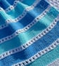 Pale blue and aqua striped baby blanket in 100% cotton 
