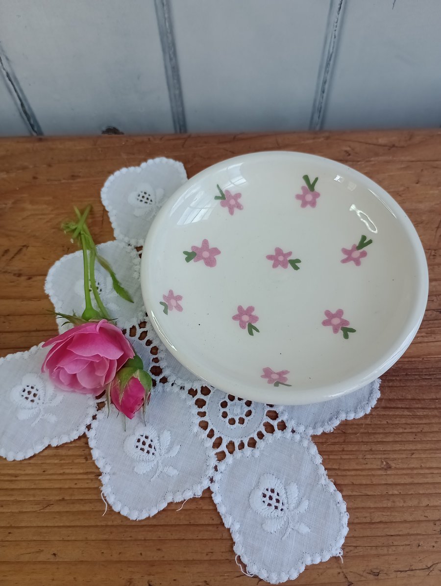White jewellery dish with pink flowers