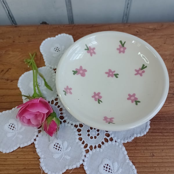 White jewellery dish with pink flowers