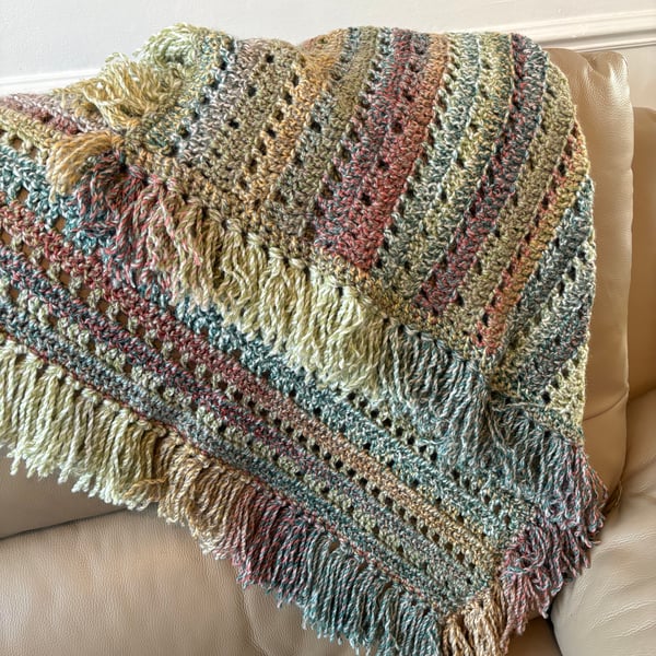 Beautiful fringed blanket earthy tones