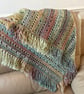 Beautiful fringed blanket earthy tones