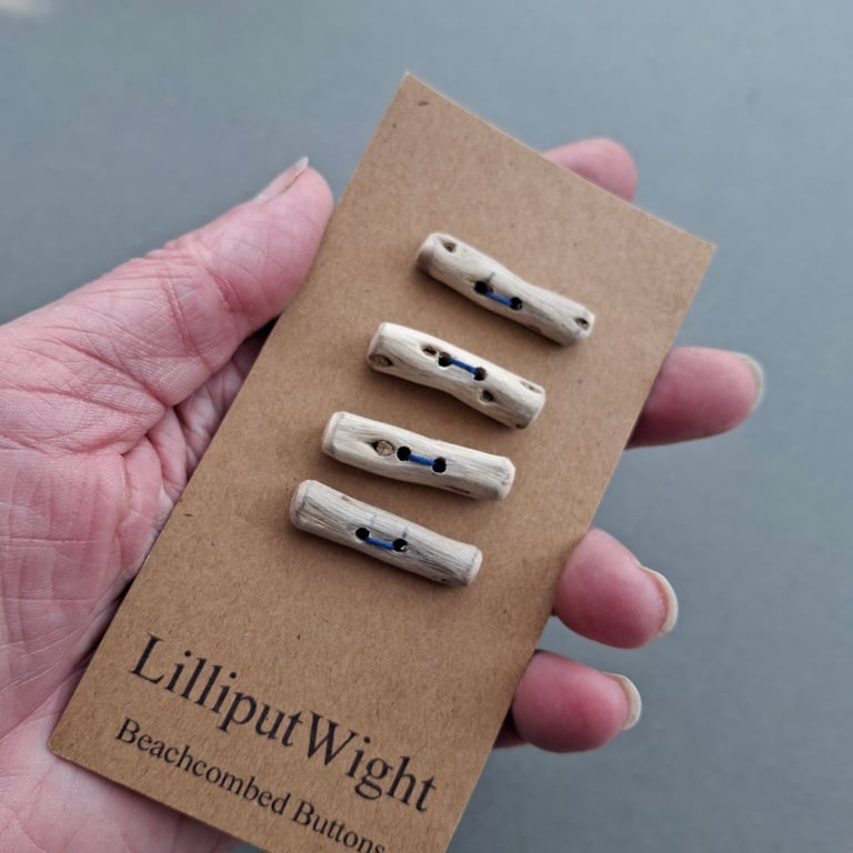 Four small driftwood toggle buttons