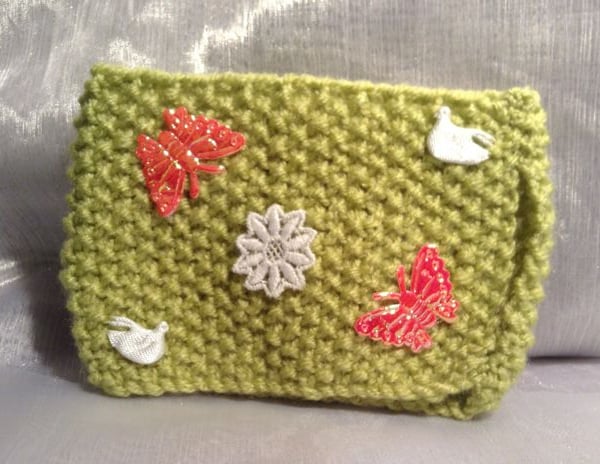 Little green decorative knitted mug warmer