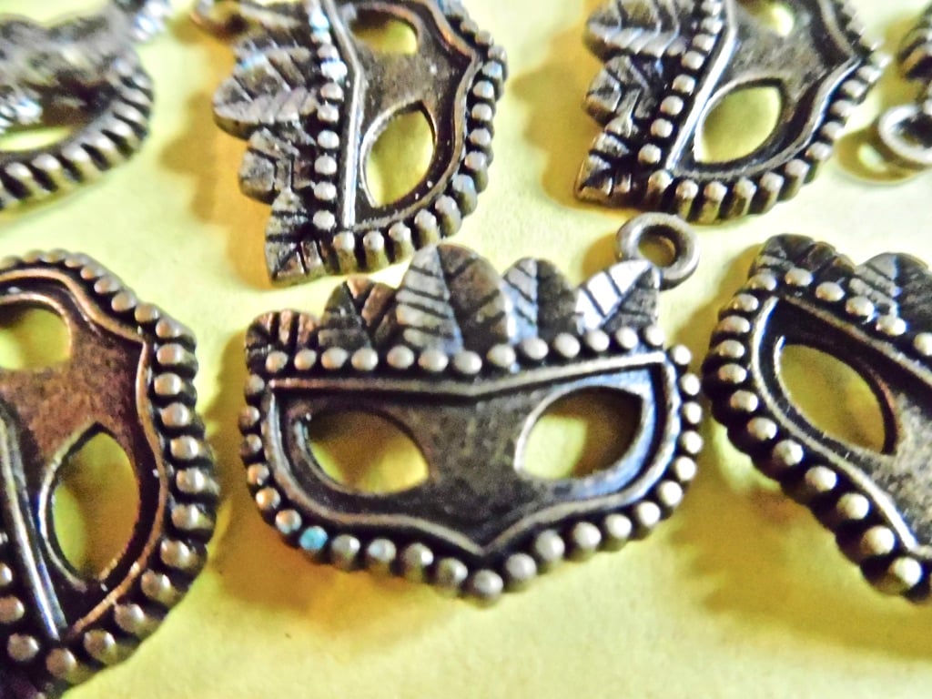 15 x Bronze Tone Masks with feathers  charms 