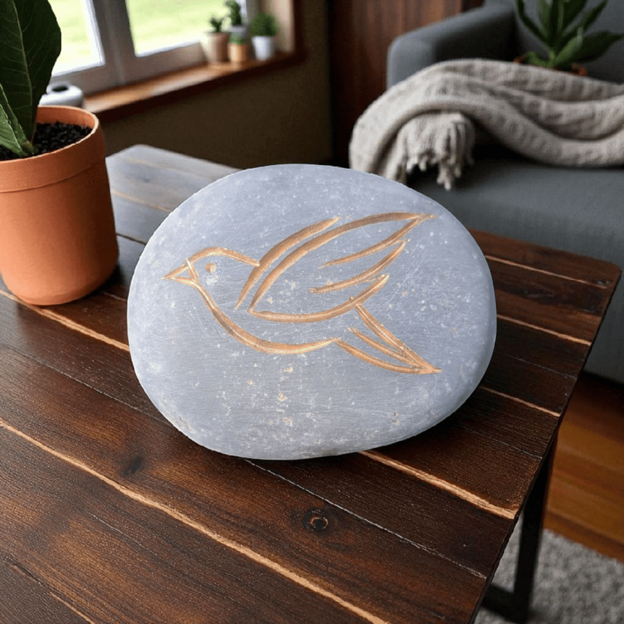 Bird with gold colour inlay, carved into Limestone pebble