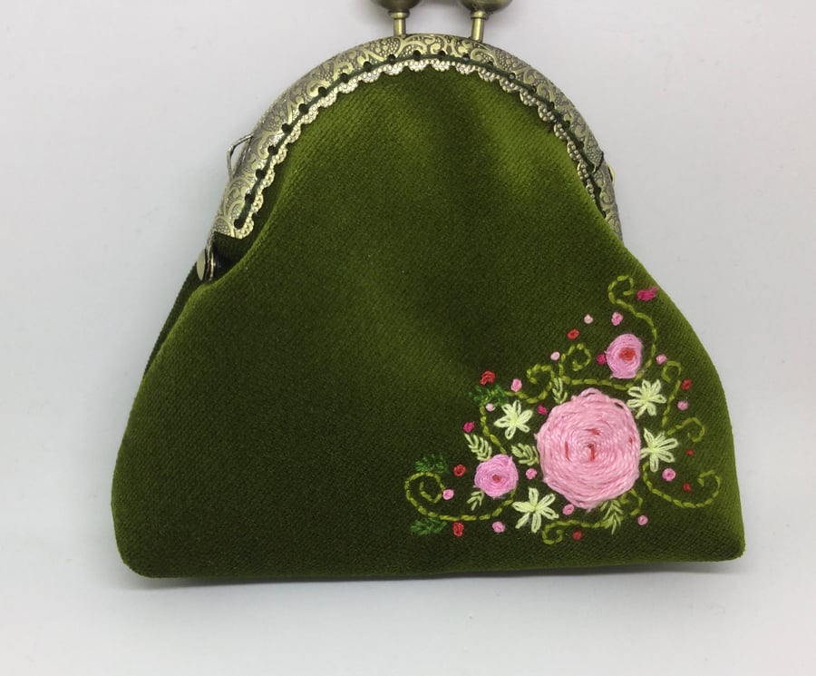 Green velvet embroidered coin purse.