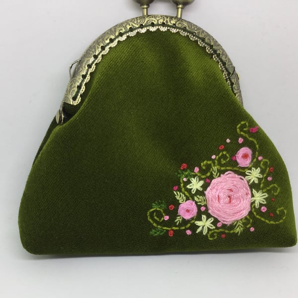 Green velvet embroidered coin purse.