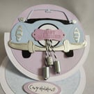 Just Married-Congratulations - an easel card with blue car and dangly tin cans  
