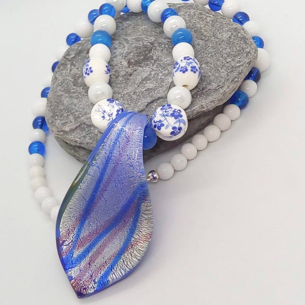 Blue Patterned Teardrop Glass Pendant on a Blue and White Beaded Necklace