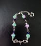 Silver, green and purple beaded animal lover lobster-clasp bracelet 