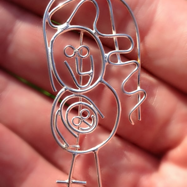 Mum with baby in her tummy. A bespoke Sterling silver brooch from a kids drawing