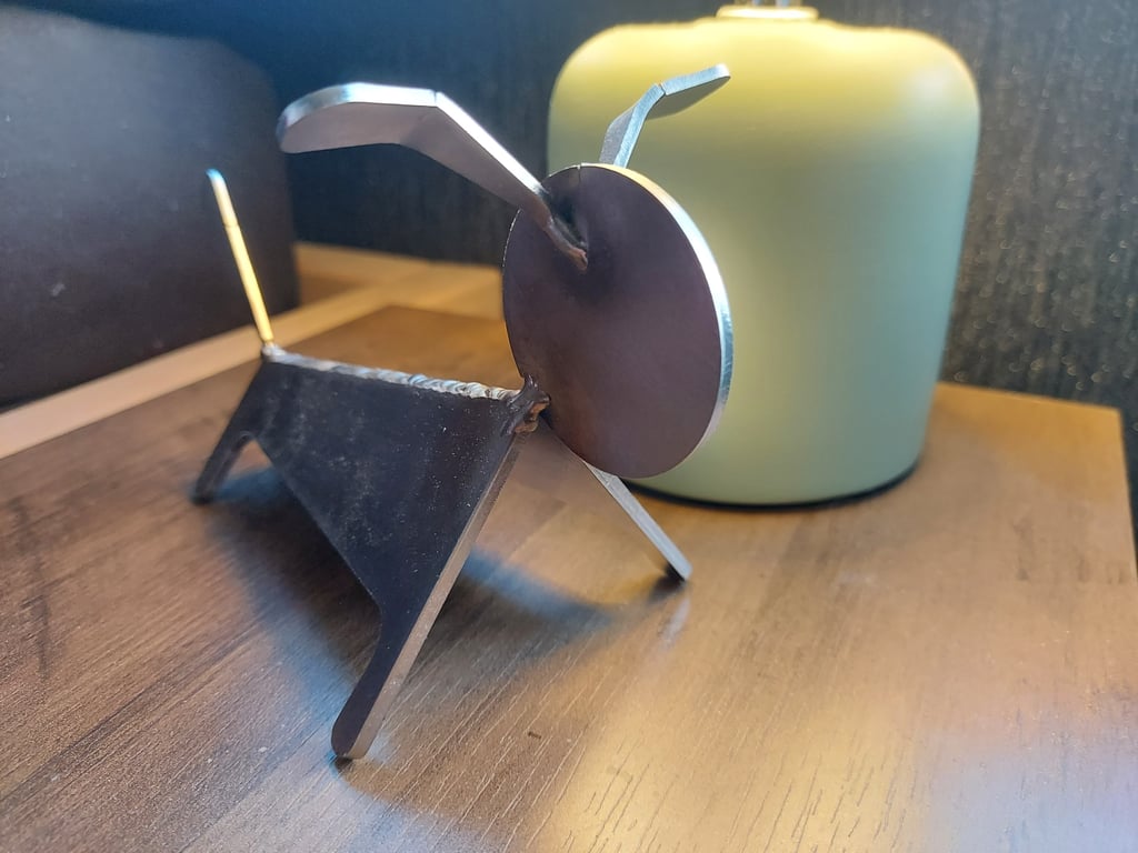 Handcrafted Industrial metal dog sculpture figurine.
