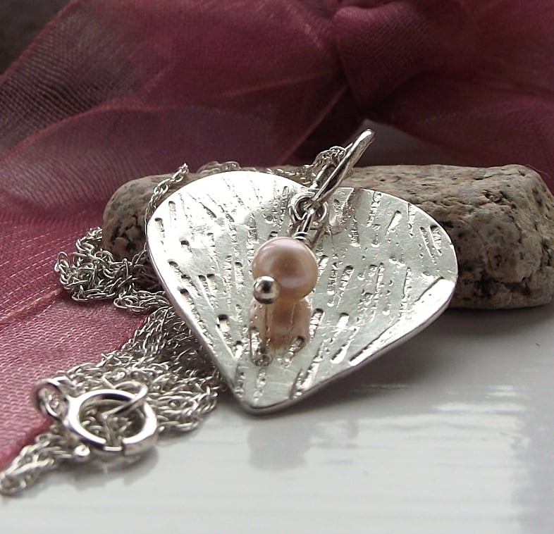 Sterling silver heart pendant with freshwater pearl.