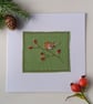 Textile Christmas Card with Embroidered Robin on a Rosehip Branch