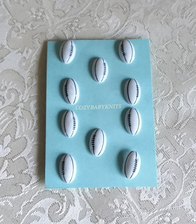 WHITE RUGBY BUTTONS WITH A SHANK ON THE BACK TO SECURE ONTO THE GARMENT