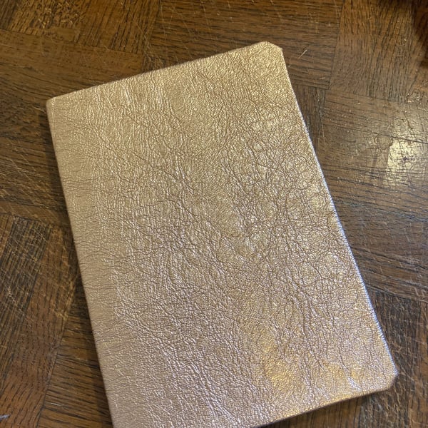 A5: Shiny Metallic Rose Gold colour soft leatherbound graph lined notebook 
