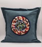 Teal envelope cushion cover, colourful circular centre.  - Image 1