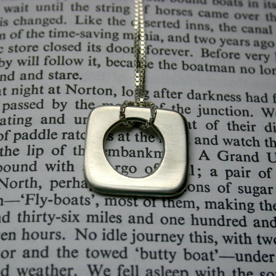 Solid sterling silver pendant.