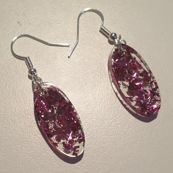 Oval pink metallic flakes resin earrings