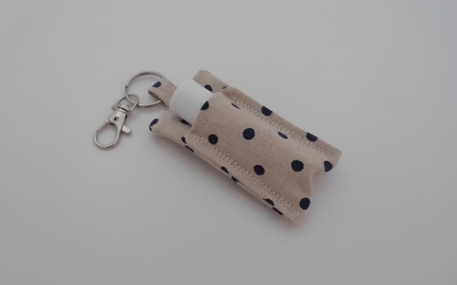 Key ring lip balm holder in spotty fabric