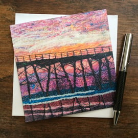 Embroidered sunset seaside pier printed greetings card. 