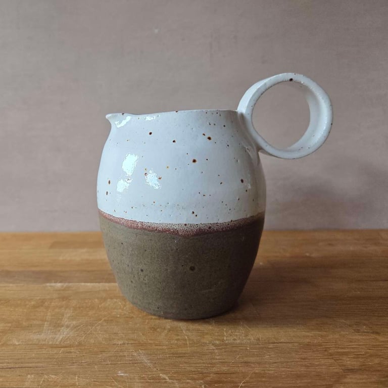 Wheel thrown Ceramic Round-Bellied Jug, in brown and white with loop handle 