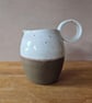 Wheel thrown Ceramic Round-Bellied Jug, in brown and white with loop handle 