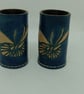 Pair of hand carved and tooled dice cups, butterfly design