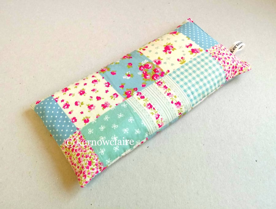 Lavender eye pillow in peach with turquoise flowers