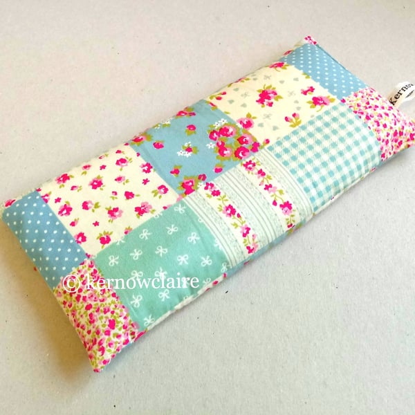 Lavender eye pillow in peach with turquoise flowers