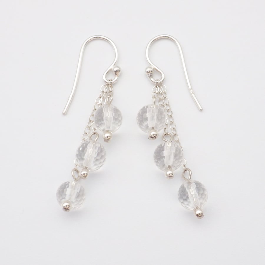 Faceted clear rock crystal three tier round bead earrings